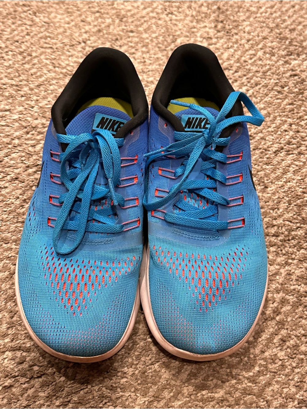 Nike Men’s Blue Athletic Running Shoes with Pink Accents